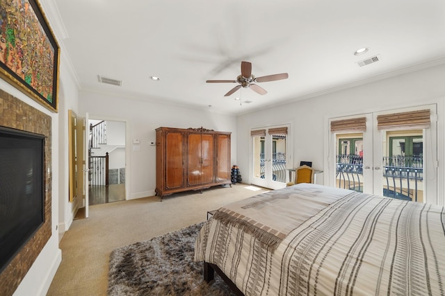 carpeted bedroom featuring access to exterior, french doors, ceiling fan, and ornamental molding