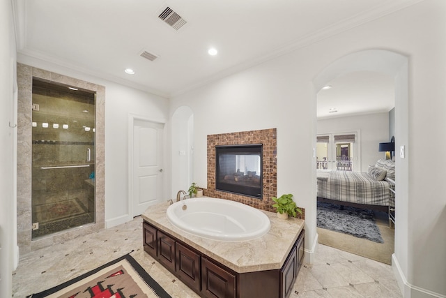 bathroom with a multi sided fireplace, plus walk in shower, and ornamental molding