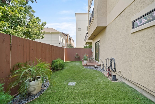 view of yard with a wooden deck