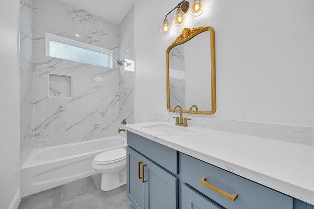 full bathroom with vanity, tiled shower / bath combo, and toilet