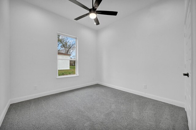 empty room featuring carpet floors and ceiling fan