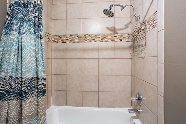 bathroom with shower / tub combo with curtain