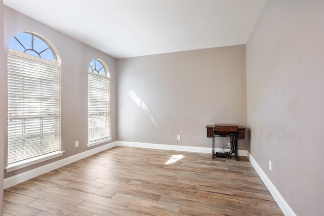 empty room with light hardwood / wood-style floors