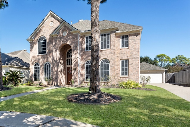 view of front of house featuring a front yard and a garage