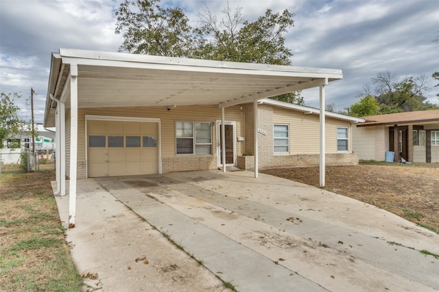 view of front of house featuring a garage and a carport