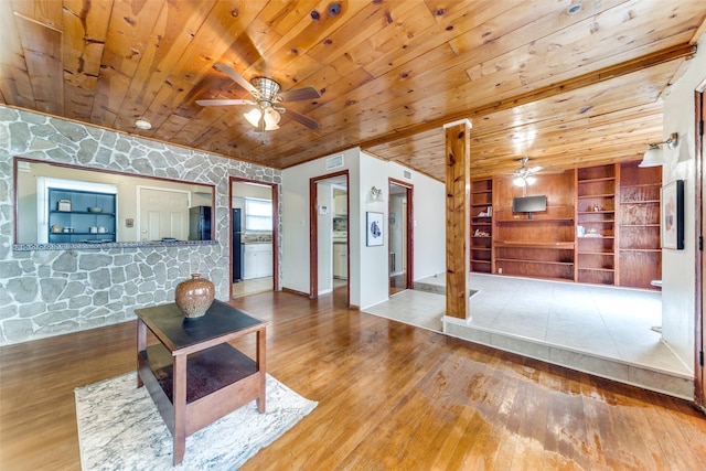 unfurnished living room with hardwood / wood-style floors, ceiling fan, and wood ceiling