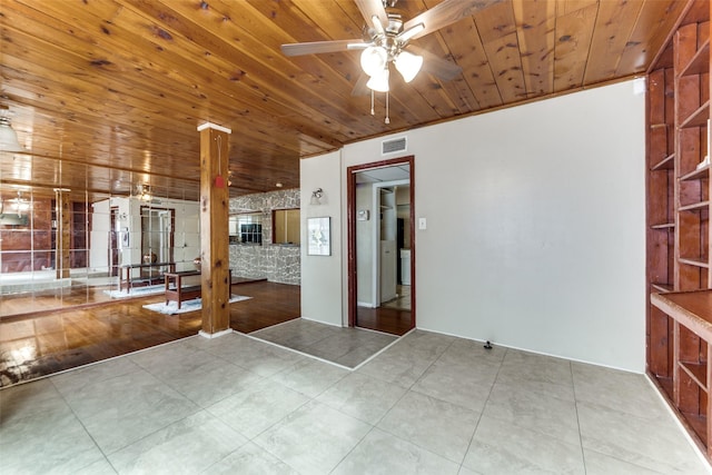 empty room featuring ceiling fan, wooden ceiling, and crown molding