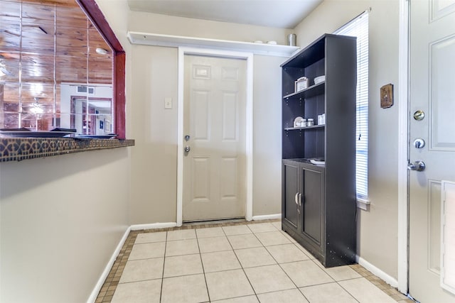 entryway featuring light tile patterned floors