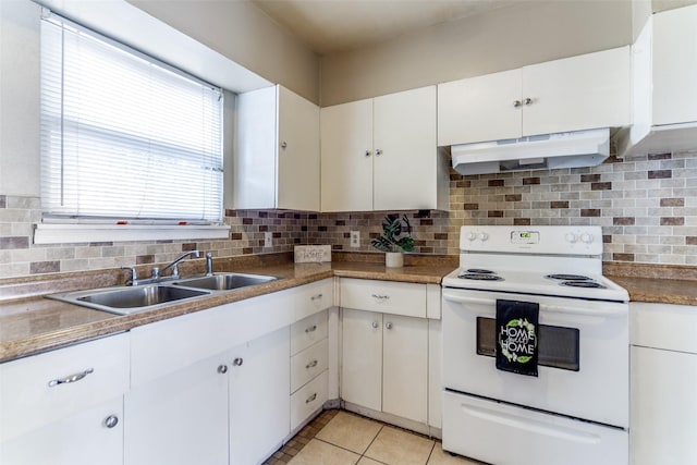 kitchen featuring white cabinets, light tile patterned flooring, white electric stove, and sink