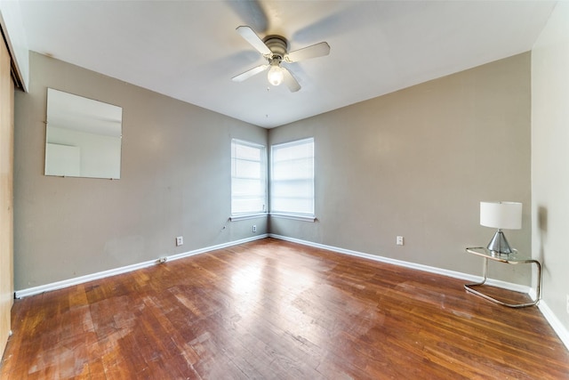 unfurnished room with ceiling fan and hardwood / wood-style flooring