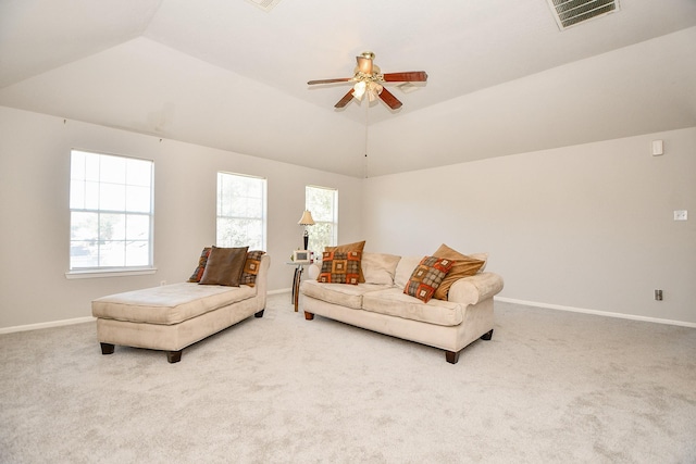 carpeted living room featuring lofted ceiling, visible vents, ceiling fan, and baseboards