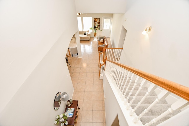 staircase featuring tile patterned floors