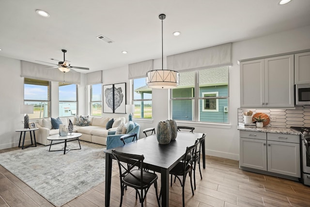 dining space with ceiling fan