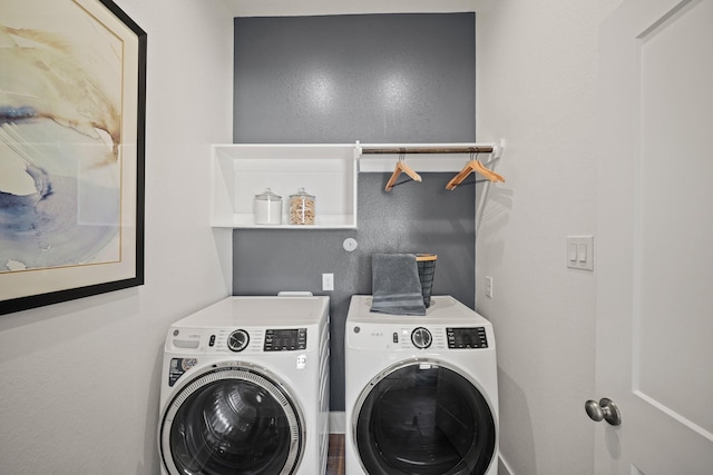 laundry area with washing machine and dryer