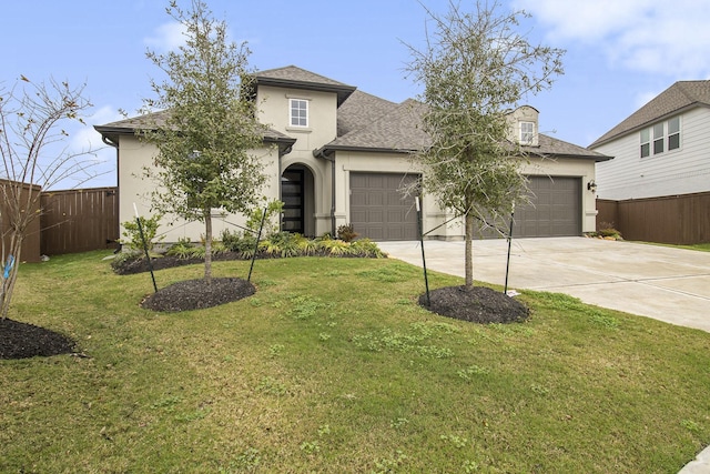 view of front facade featuring a garage and a front lawn