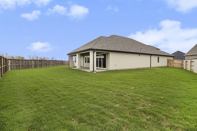 back of property with a patio and a lawn