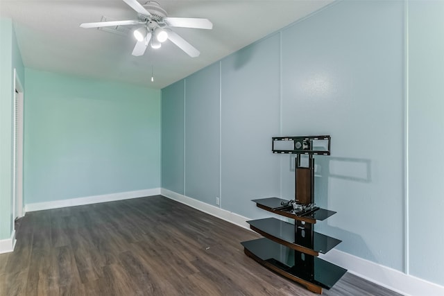 spare room featuring ceiling fan and dark hardwood / wood-style flooring