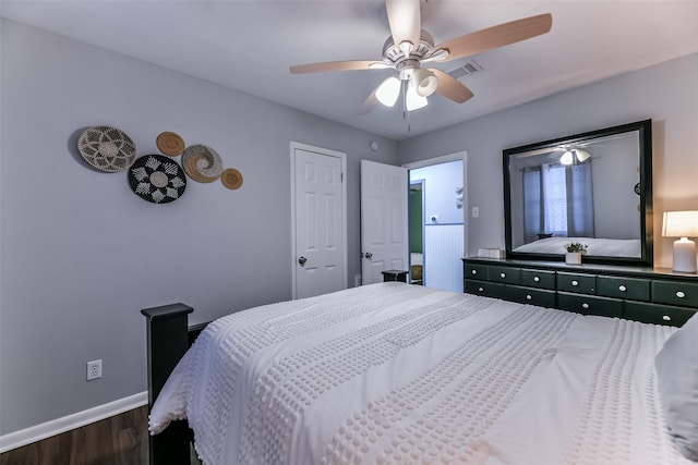 bedroom with ceiling fan and dark wood-type flooring