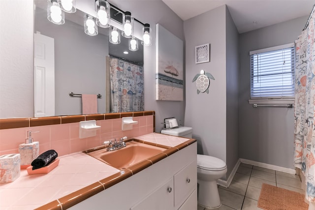 bathroom featuring backsplash, tile patterned flooring, vanity, and toilet