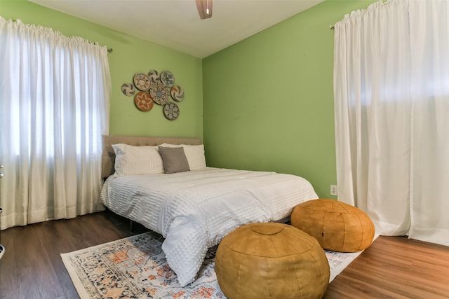 bedroom with hardwood / wood-style flooring and ceiling fan