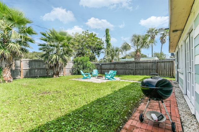 view of yard with a patio and a fire pit