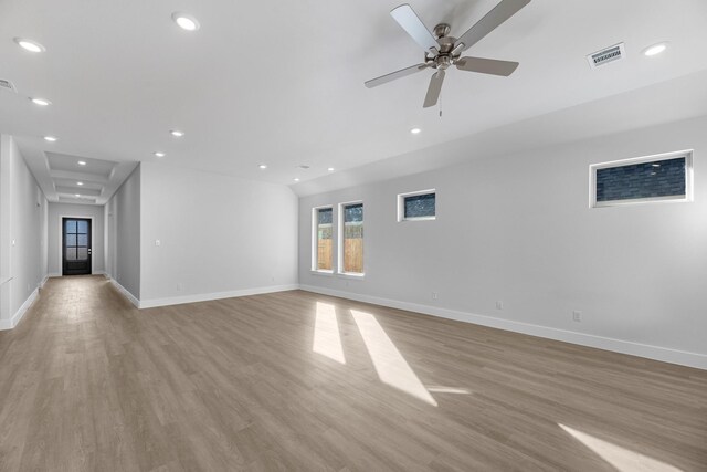 empty room with ceiling fan and light wood-type flooring