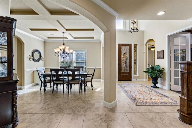 tiled entrance foyer featuring beam ceiling, an inviting chandelier, coffered ceiling, and crown molding