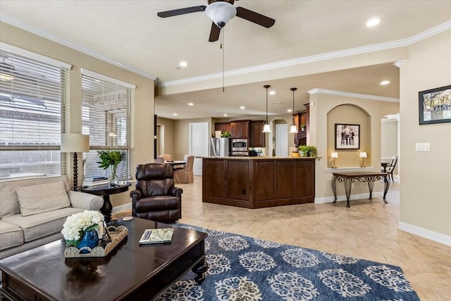 living room featuring ceiling fan and crown molding