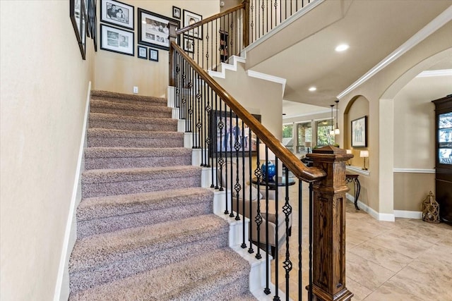 stairs featuring ornamental molding