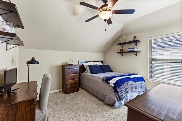 carpeted bedroom featuring multiple windows, ceiling fan, and lofted ceiling