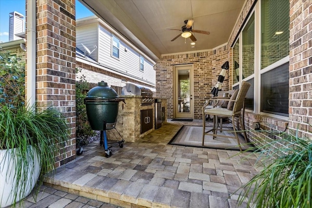 view of patio featuring ceiling fan and exterior kitchen