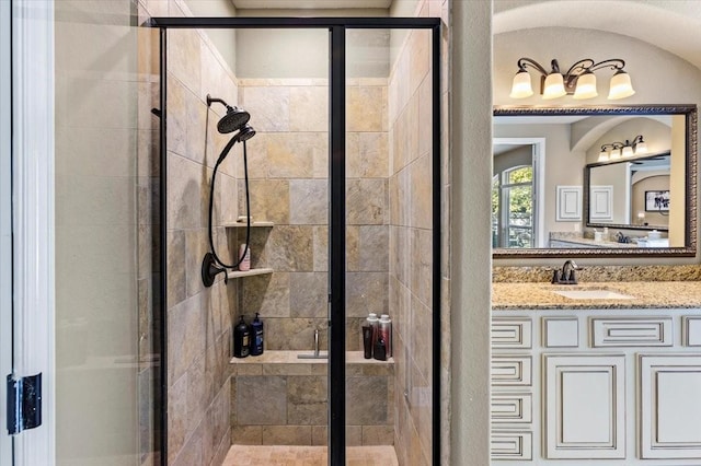 bathroom with vanity and an enclosed shower