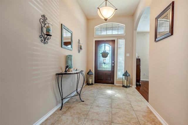 foyer entrance featuring light tile patterned floors