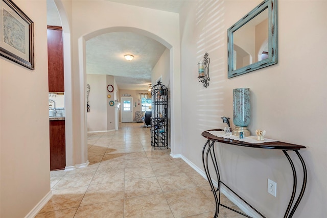 hall with light tile patterned flooring