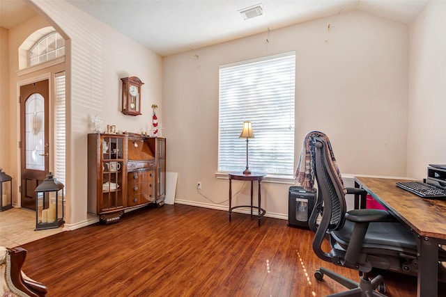 office featuring dark hardwood / wood-style flooring and lofted ceiling