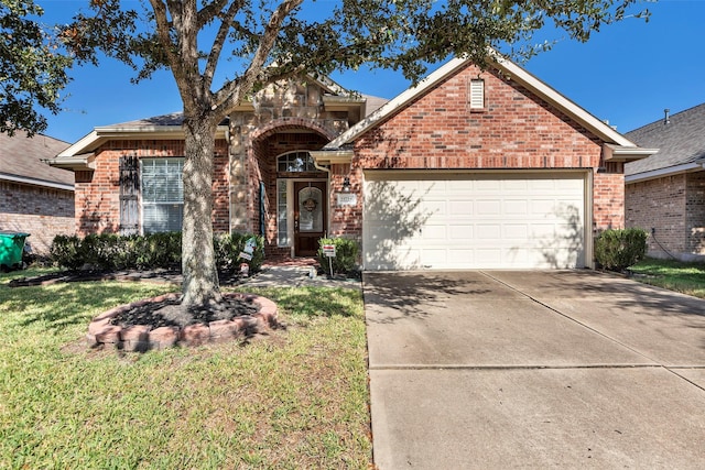 view of front facade with a garage and a front yard