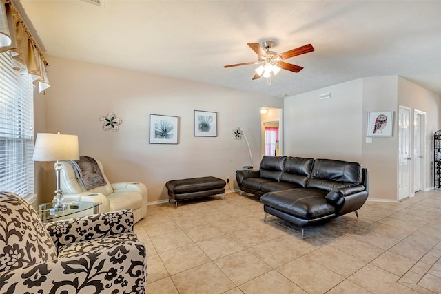 living room featuring ceiling fan and light tile patterned floors