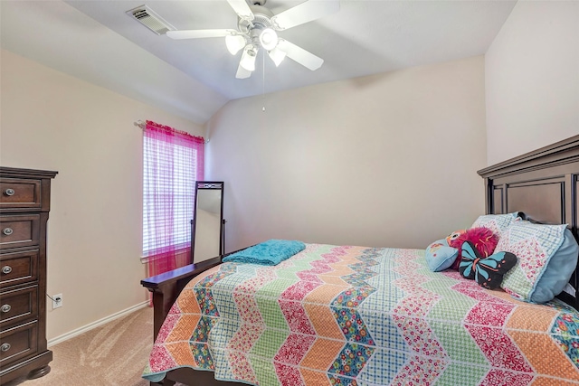 bedroom with ceiling fan, light carpet, and vaulted ceiling