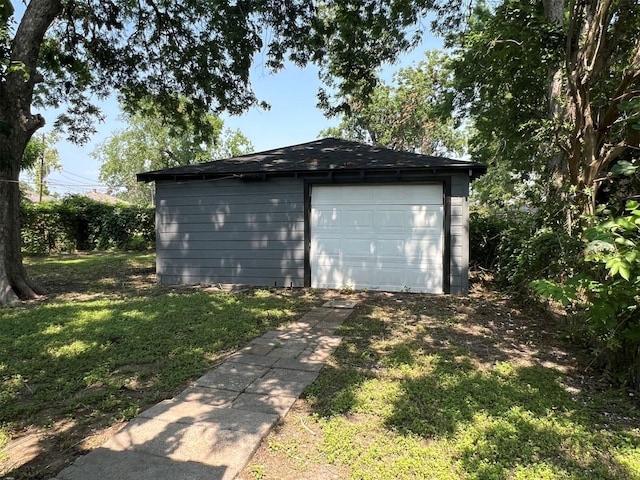 garage featuring a yard