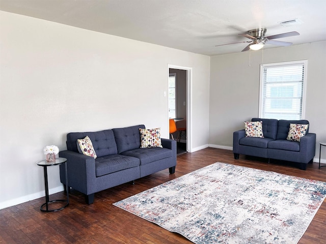 living room with ceiling fan and dark hardwood / wood-style flooring