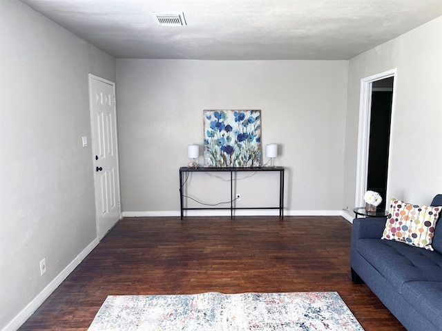 living room featuring dark hardwood / wood-style floors