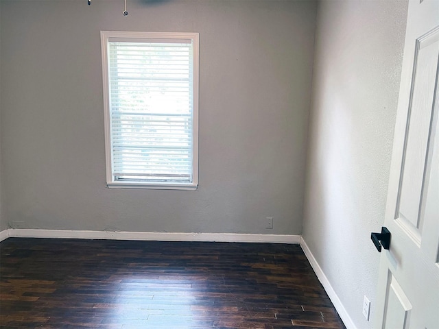 spare room featuring dark hardwood / wood-style flooring