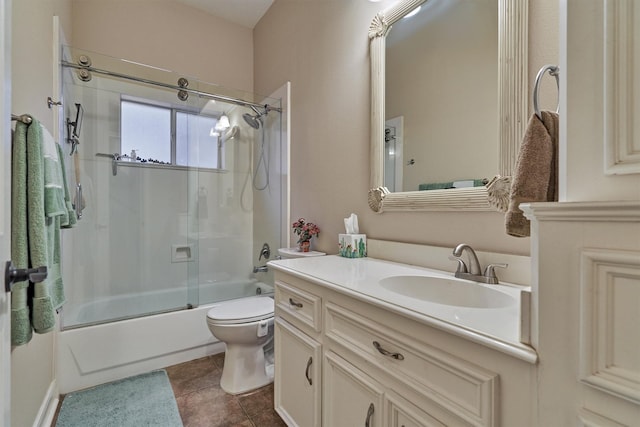 full bathroom featuring tile patterned floors, vanity, toilet, and shower / bath combination with glass door