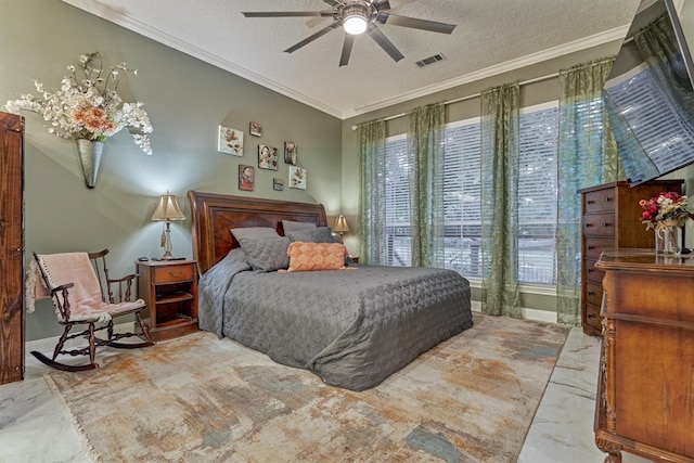 bedroom with ceiling fan, a textured ceiling, and ornamental molding