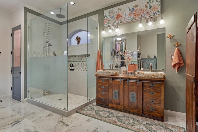 bathroom featuring crown molding, vanity, and tiled shower