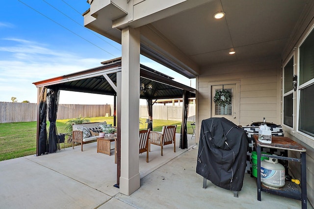 view of patio / terrace with a gazebo, area for grilling, and an outdoor living space