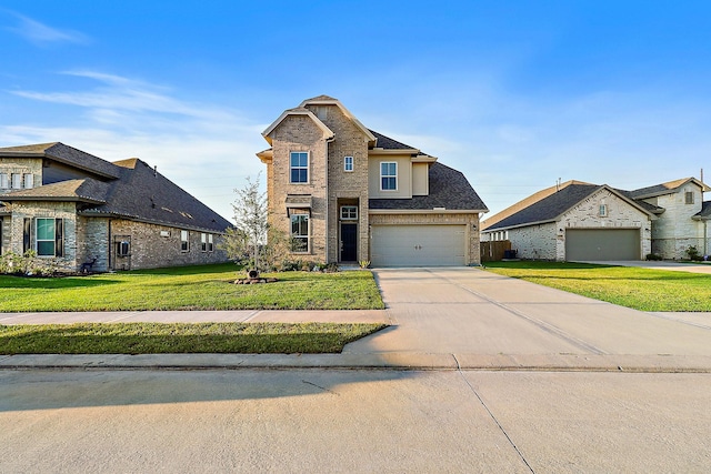 view of front of property featuring a front lawn and a garage