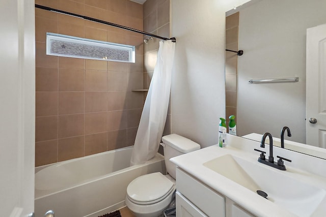 full bathroom featuring shower / bath combo, vanity, and toilet