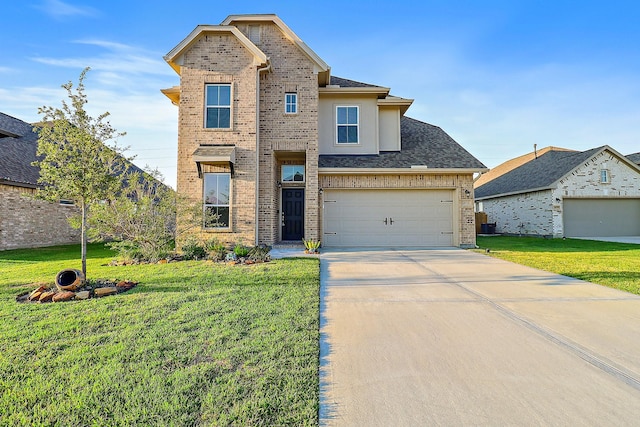 view of front of property with a garage and a front lawn