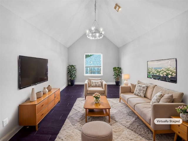 living room with vaulted ceiling and an inviting chandelier